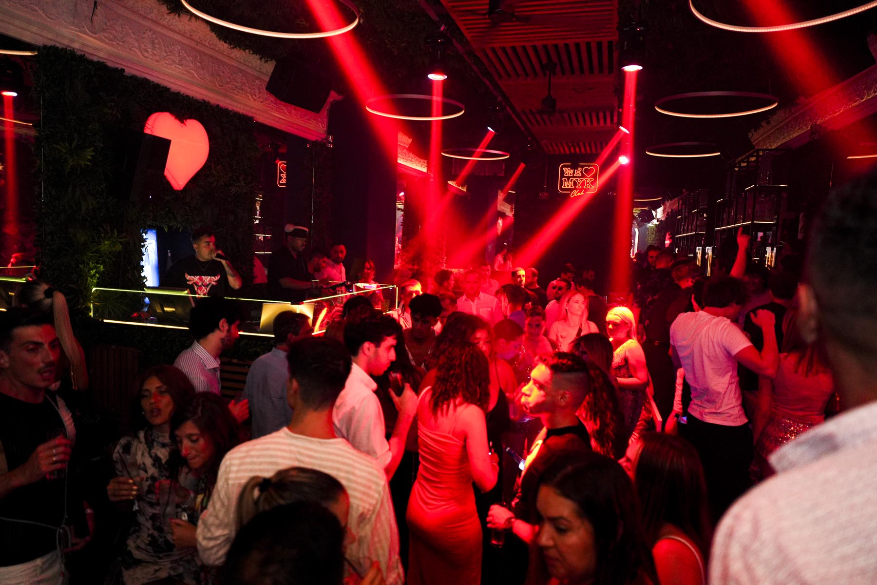 "Vibrant nightlife crowd at We Love Mykonos open-air club, Mykonos Town"