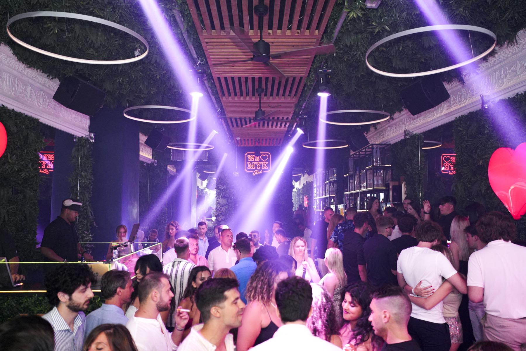"Vibrant nightlife crowd at We Love Mykonos open-air club, Mykonos Town"